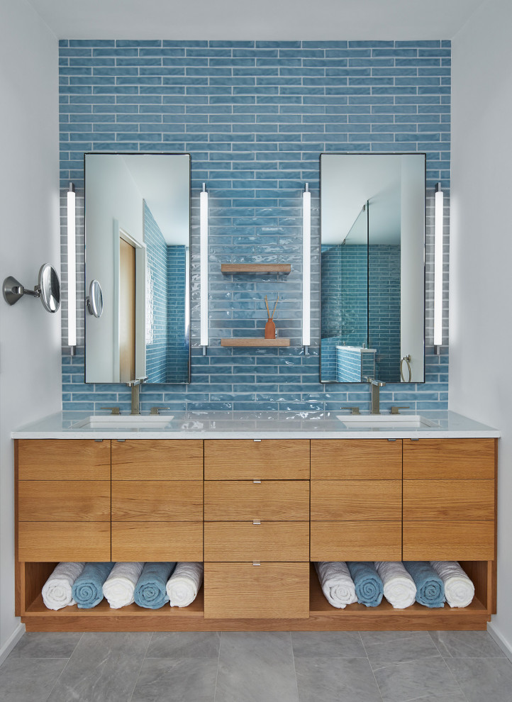 Mid-sized midcentury master bathroom in DC Metro with flat-panel cabinets, a freestanding tub, a curbless shower, a two-piece toilet, blue tile, ceramic tile, white walls, marble floors, an undermount sink, engineered quartz benchtops, grey floor, an open shower, white benchtops, a double vanity and a built-in vanity.