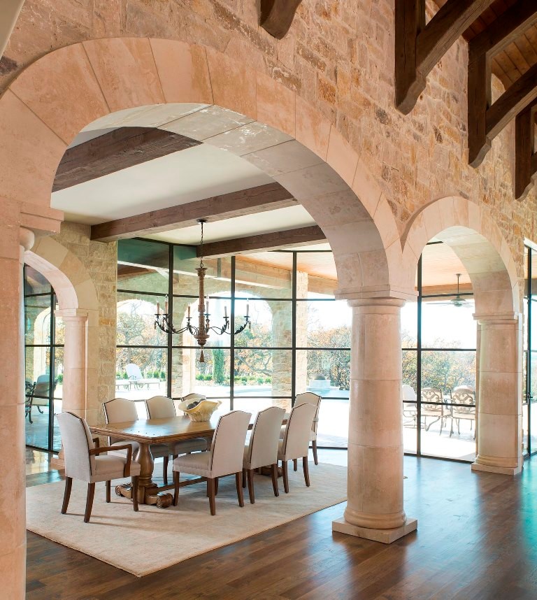 Photo of a large mediterranean open plan dining in Dallas with light hardwood floors.
