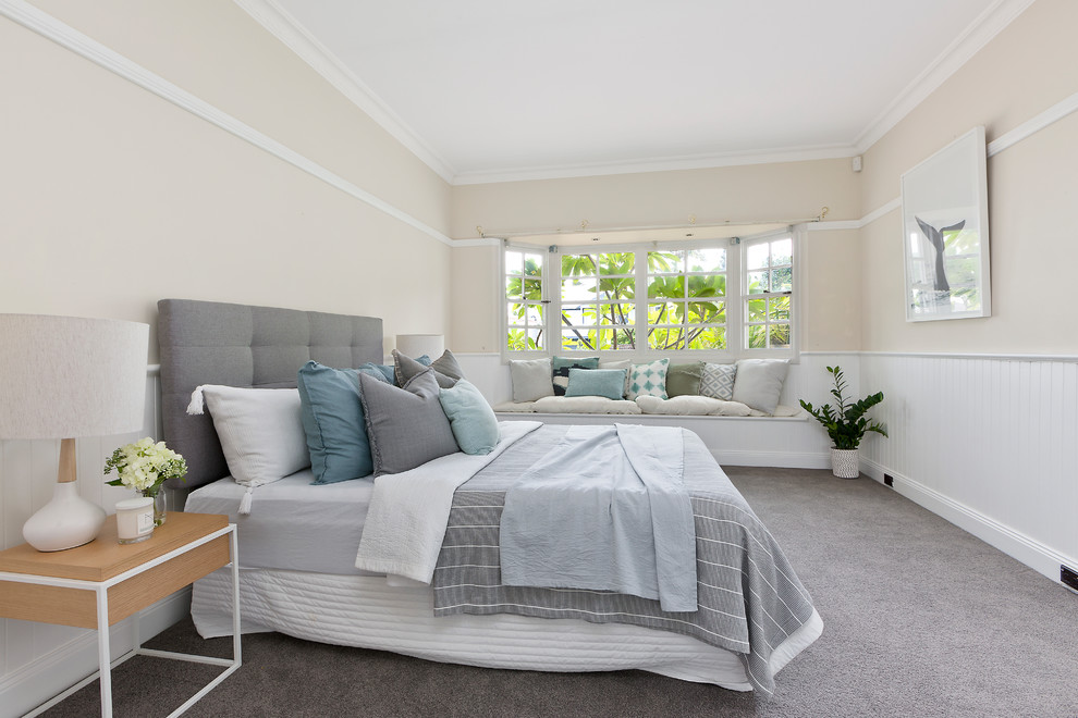 Photo of a large transitional master bedroom in Sydney with carpet, grey floor, beige walls and no fireplace.
