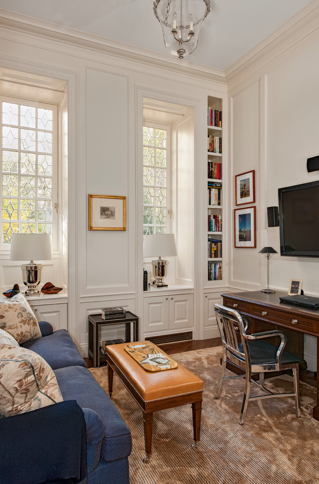 Inspiration for a traditional home office in New York with white walls, dark hardwood floors and a freestanding desk.