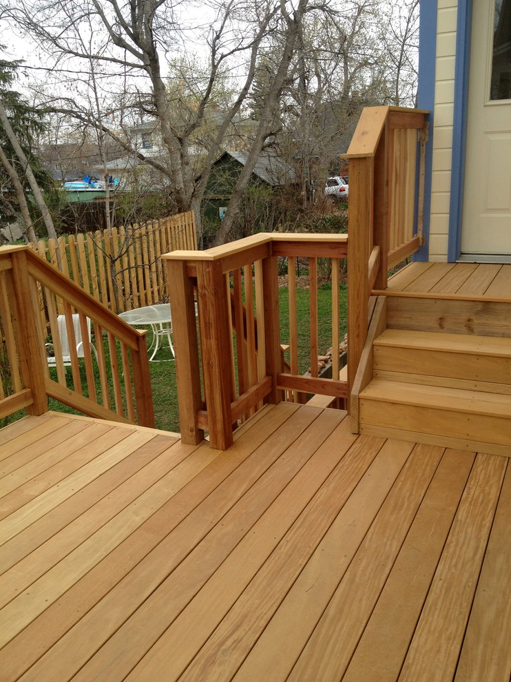 Inspiration for a large timeless backyard deck remodel in Denver with no cover