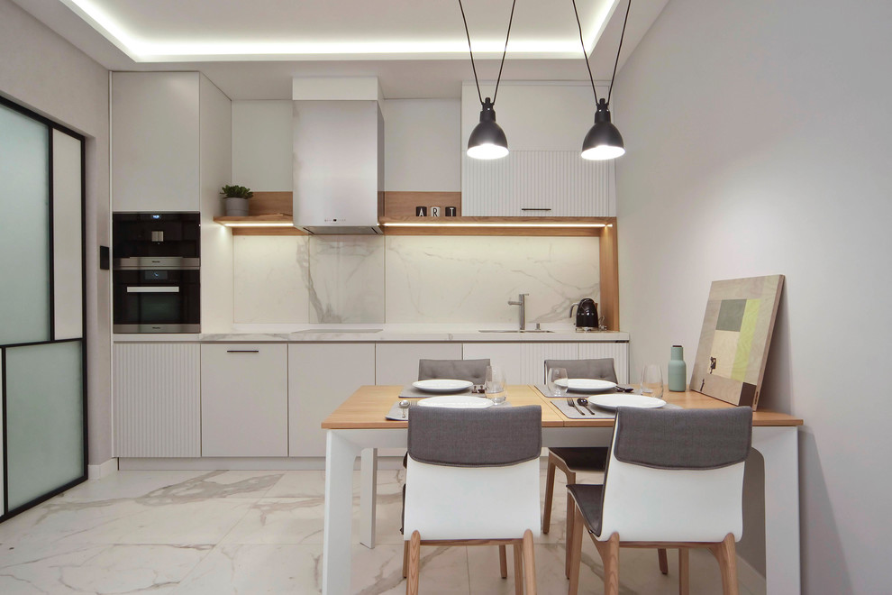 This is an example of a small modern single-wall eat-in kitchen in Other with an integrated sink, open cabinets, white cabinets, white splashback, ceramic floors, no island and white floor.