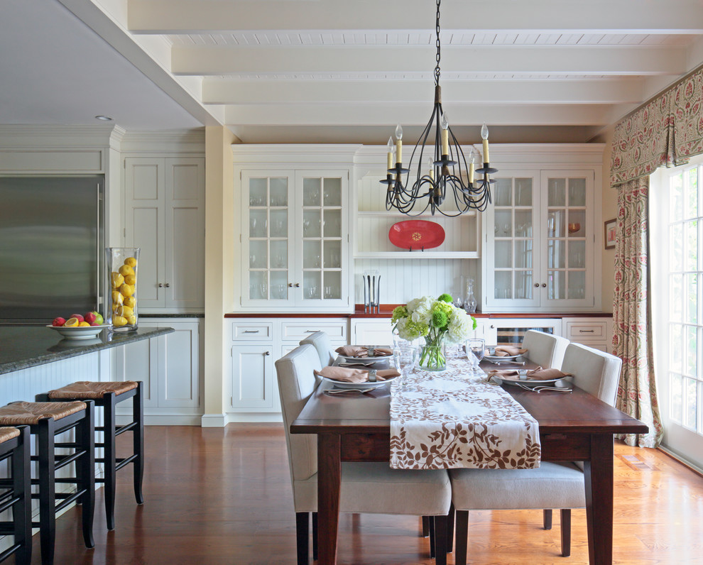 This is an example of a traditional kitchen/dining combo in New York with medium hardwood floors.