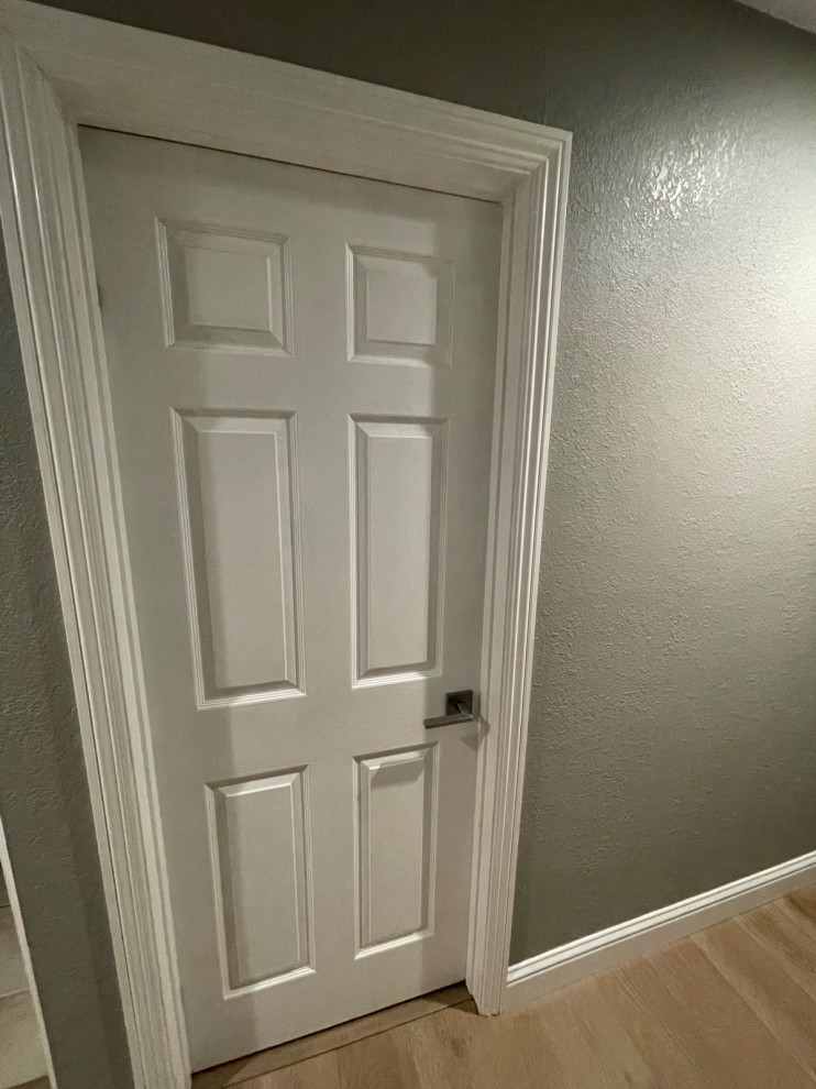 how to flush inswing door against wall?