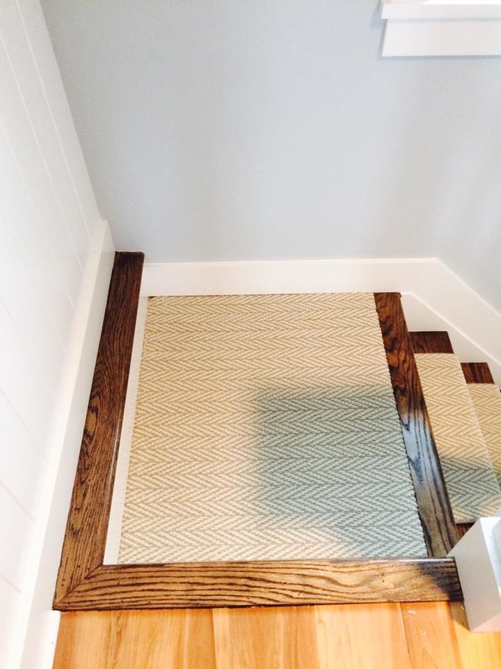 Design ideas for a mid-sized traditional wood straight staircase in New York with painted wood risers.