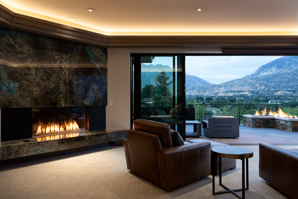 Design ideas for an expansive asian master bedroom in Salt Lake City with beige walls, carpet, a standard fireplace, a stone fireplace surround, beige floor and recessed.