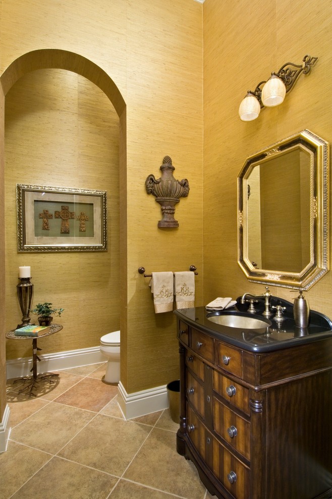 Inspiration for a mediterranean powder room in Miami with an undermount sink.