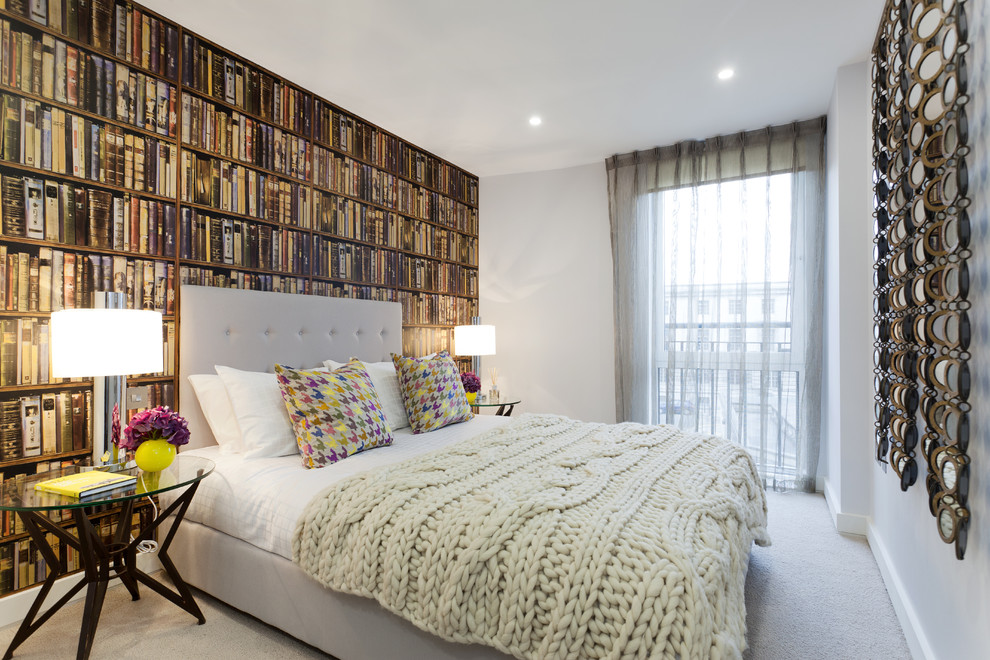 Eclectic bedroom in London with multi-coloured walls and carpet.