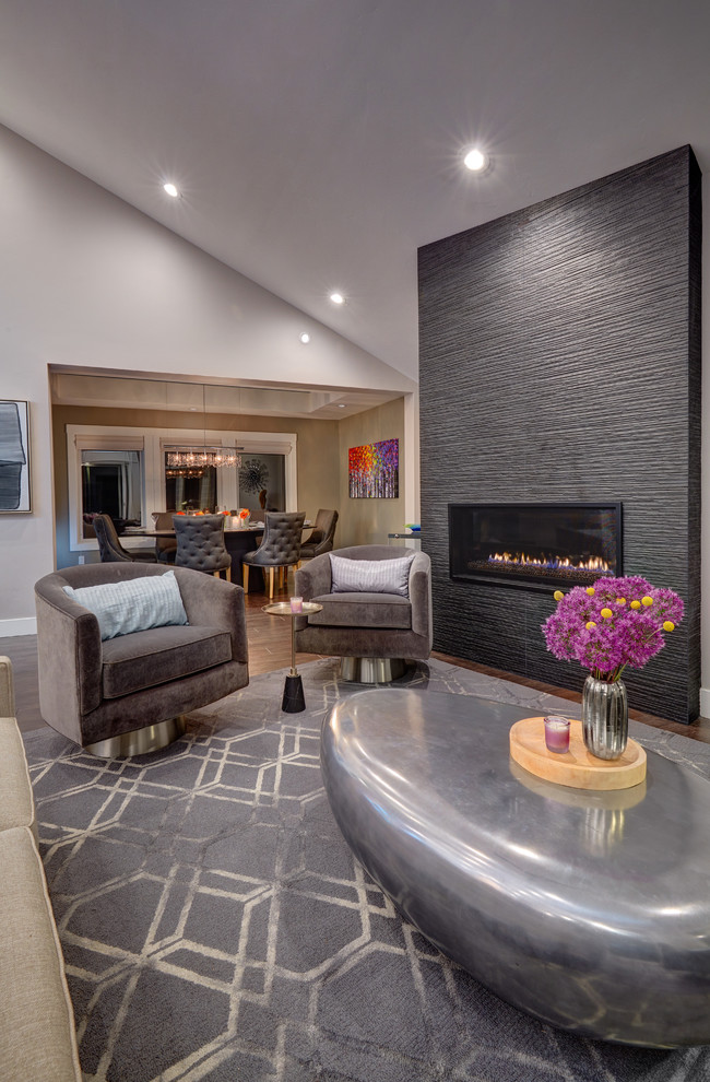 Photo of a mid-sized contemporary formal living room in Sacramento with medium hardwood floors, grey walls and a ribbon fireplace.