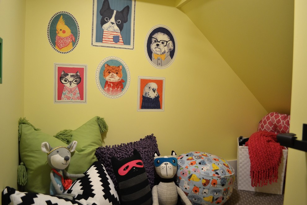 Photo of a small eclectic gender-neutral kids' playroom in Detroit with yellow walls, carpet and grey floor.