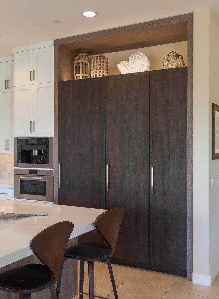 Example of a large transitional l-shaped open concept kitchen design in Denver with shaker cabinets, white cabinets and an island