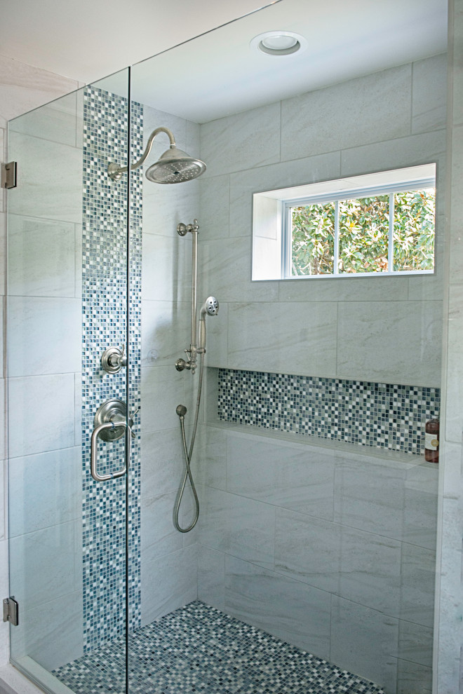 Photo of a large transitional master bathroom in Nashville with a corner shower, beige walls, mosaic tile floors, blue floor, a hinged shower door, a niche and a built-in vanity.
