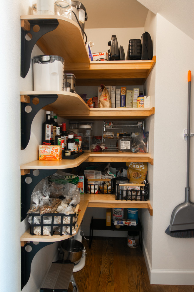 Example of a mid-sized transitional l-shaped medium tone wood floor and brown floor kitchen design with an undermount sink, recessed-panel cabinets, gray cabinets, quartz countertops, white backsplash, ceramic backsplash, stainless steel appliances, a peninsula and white countertops