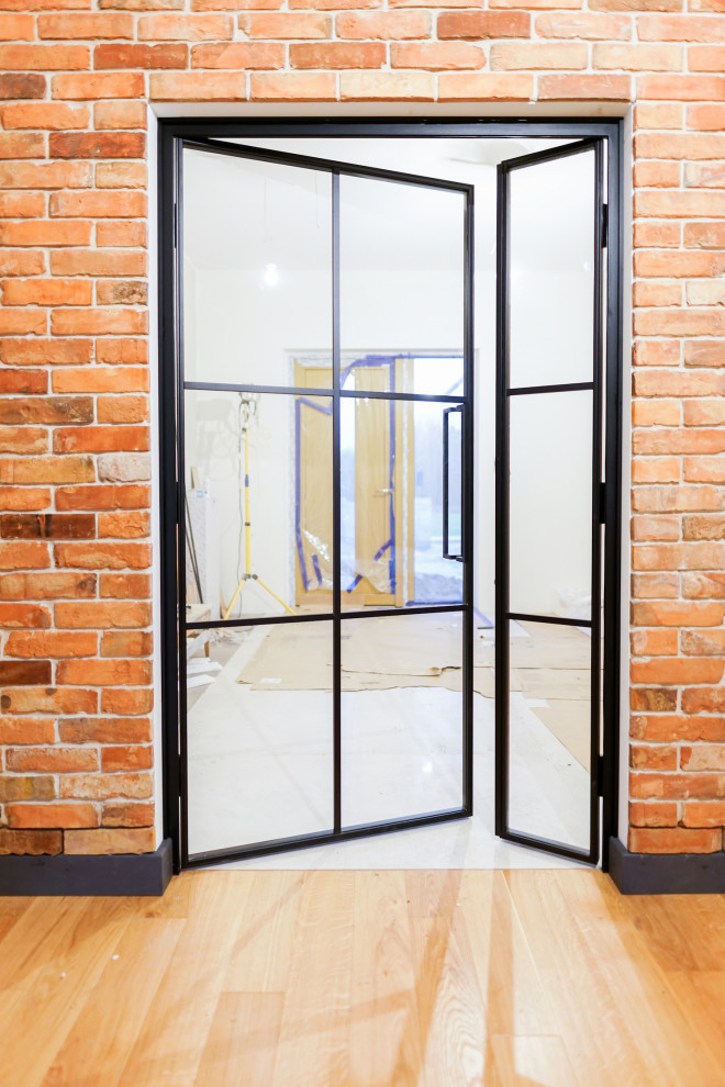 Industrialstyle steel doors with an opening panel Industrial