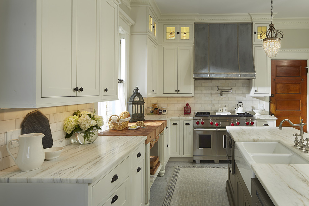 Inspiration for a large traditional l-shaped separate kitchen in Atlanta with a farmhouse sink, shaker cabinets, white cabinets, marble benchtops, white splashback, porcelain splashback, stainless steel appliances, marble floors and with island.