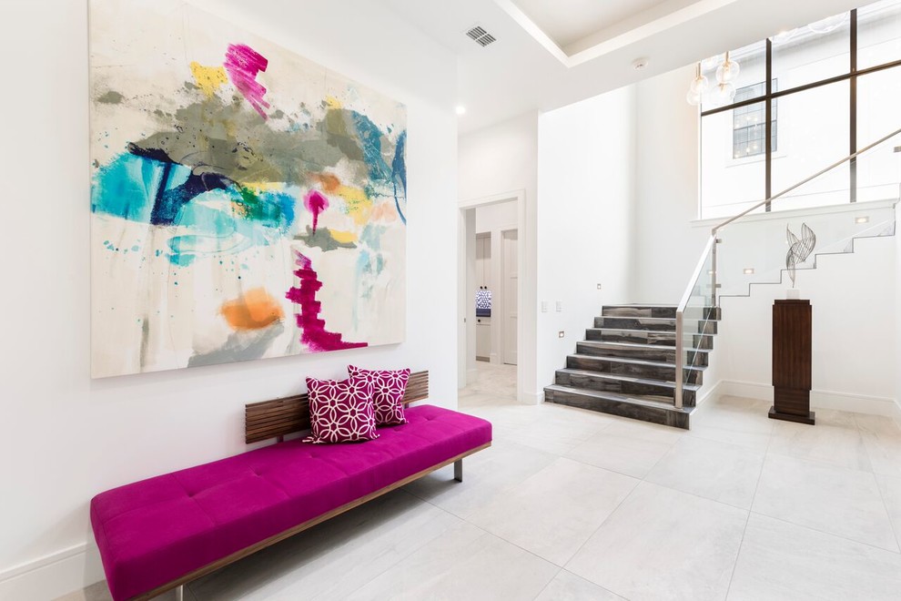 Contemporary foyer in Orlando with white walls and white floor.