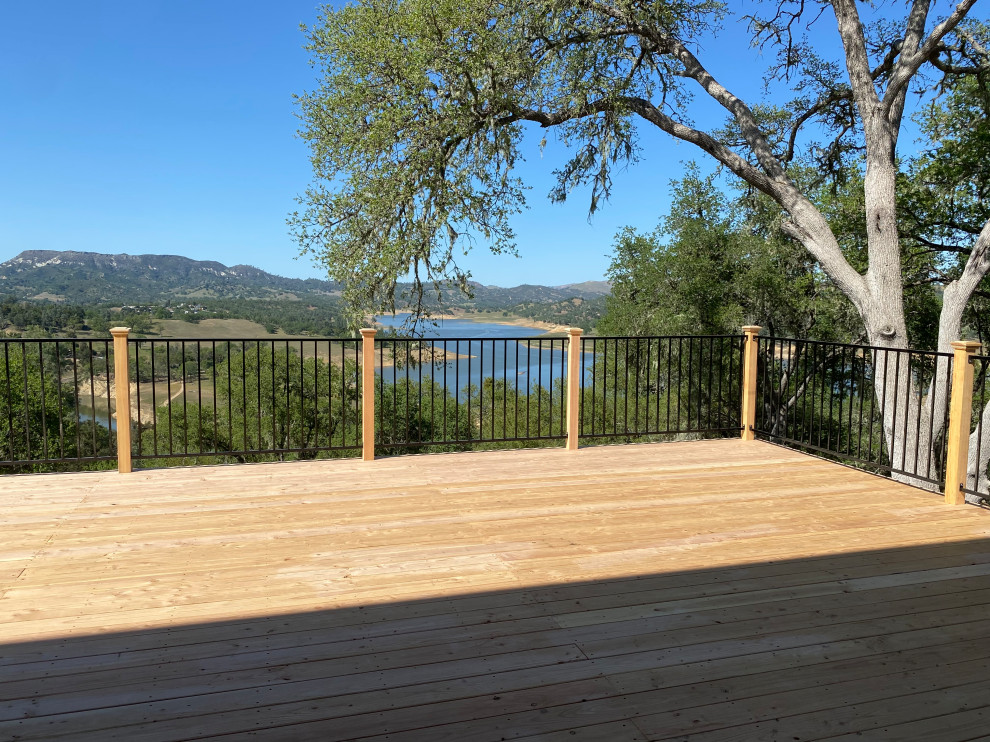 Inspiration for a mid-sized rustic backyard ground level mixed material railing deck remodel in San Luis Obispo with no cover