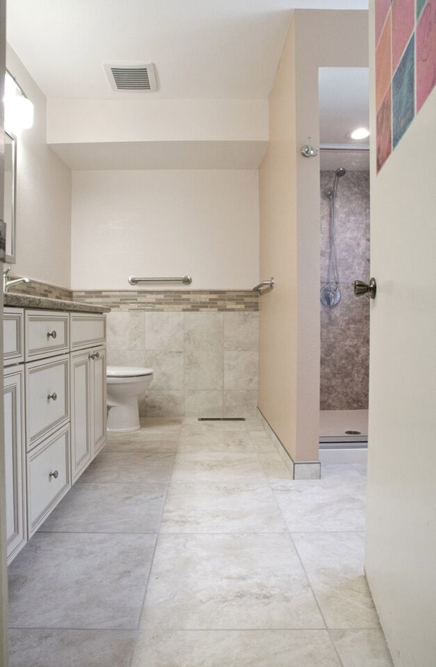 Traditional master bathroom in Other with beaded inset cabinets, white cabinets, an alcove shower, a two-piece toilet, beige tile, multi-coloured tile, matchstick tile, white walls, linoleum floors, an undermount sink and granite benchtops.