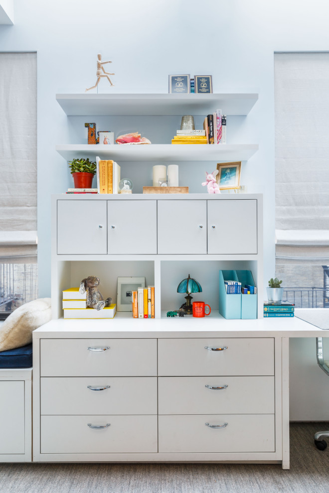 Example of a mid-sized transitional carpeted and gray floor kids' room design in New York with blue walls