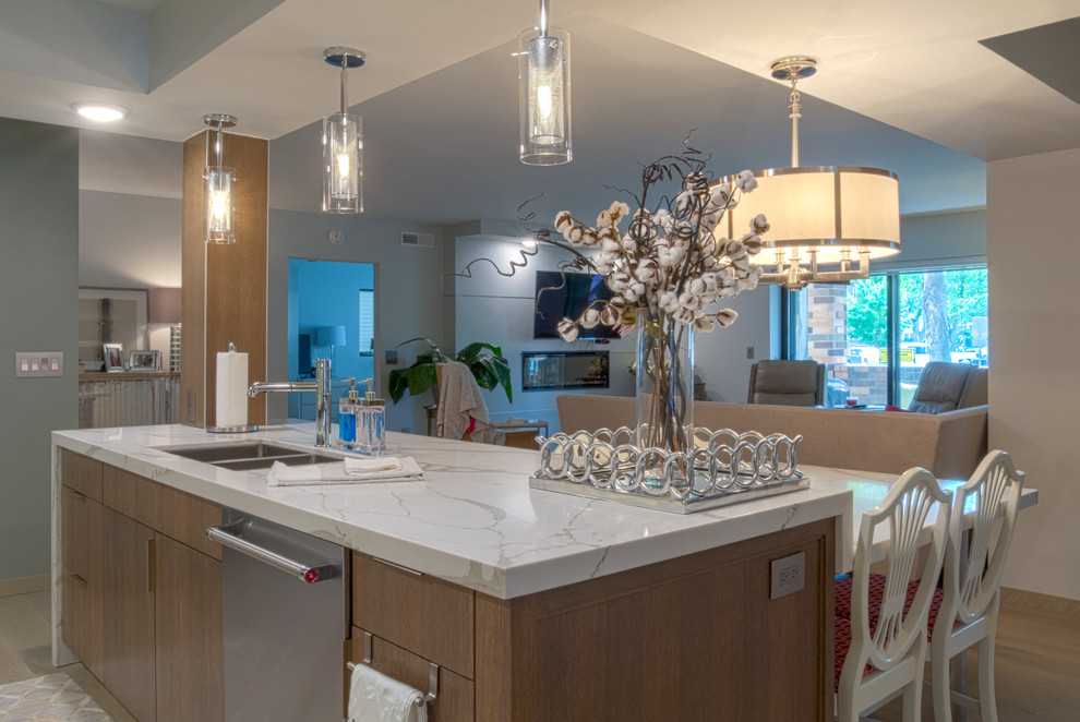 This is an example of a mid-sized contemporary single-wall eat-in kitchen in Other with a double-bowl sink, flat-panel cabinets, white cabinets, quartz benchtops, grey splashback, mosaic tile splashback, stainless steel appliances, light hardwood floors, with island and beige floor.