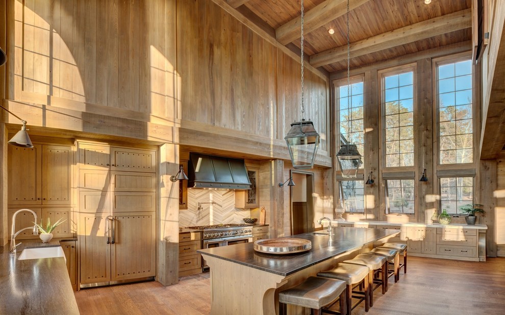 Inspiration for a large country l-shaped eat-in kitchen in Charlotte with shaker cabinets, light wood cabinets, granite benchtops, with island and a farmhouse sink.