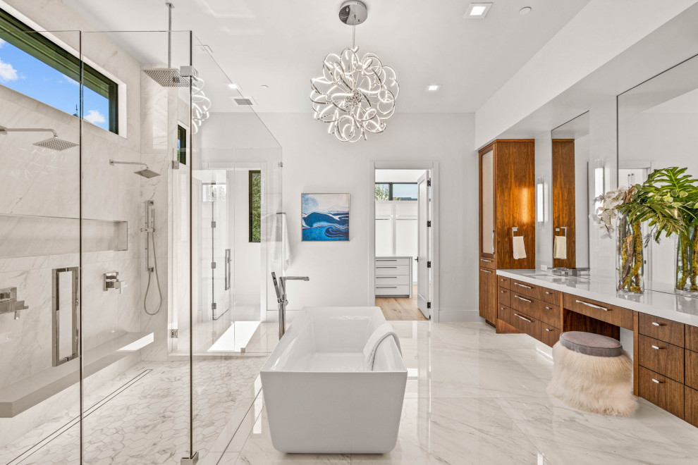 Photo of a contemporary master bathroom in Dallas with flat-panel cabinets, dark wood cabinets, a freestanding tub, a double shower, white walls, an undermount sink, white floor, a hinged shower door, white benchtops, a double vanity and a built-in vanity.