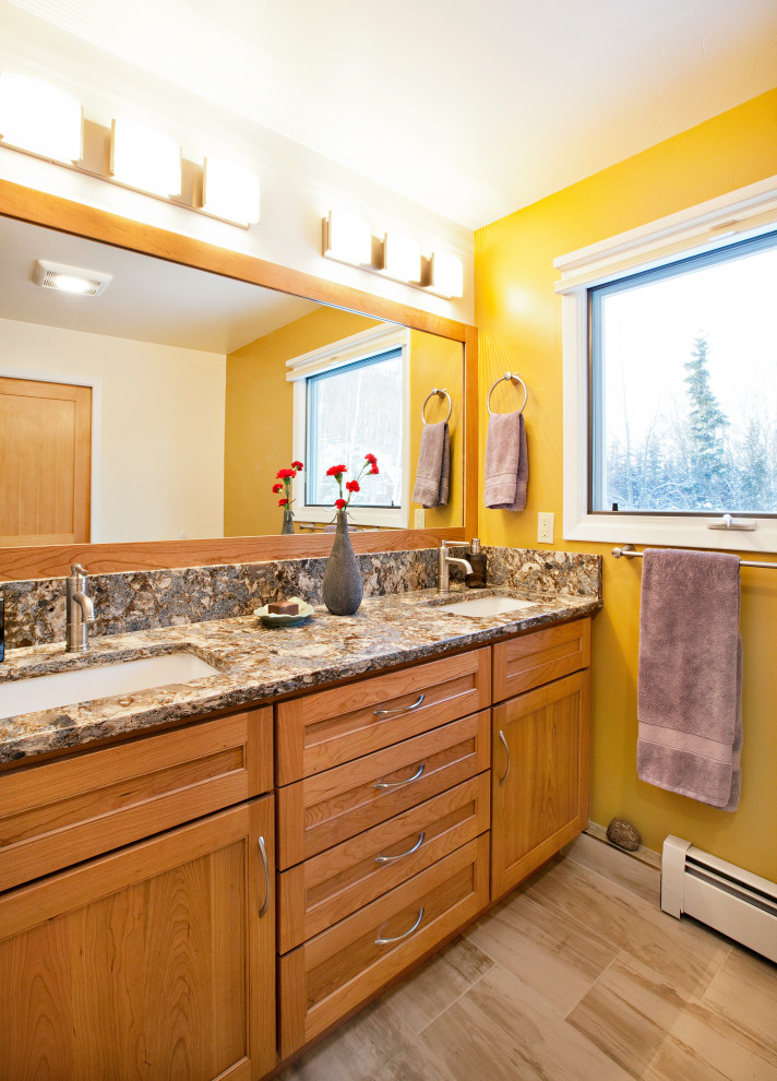 Alcove shower - mid-sized transitional 3/4 beige tile and porcelain tile porcelain tile, beige floor and double-sink alcove shower idea with shaker cabinets, medium tone wood cabinets, a two-piece toilet, yellow walls, an undermount sink, quartz countertops, brown countertops, a niche and a built-in vanity