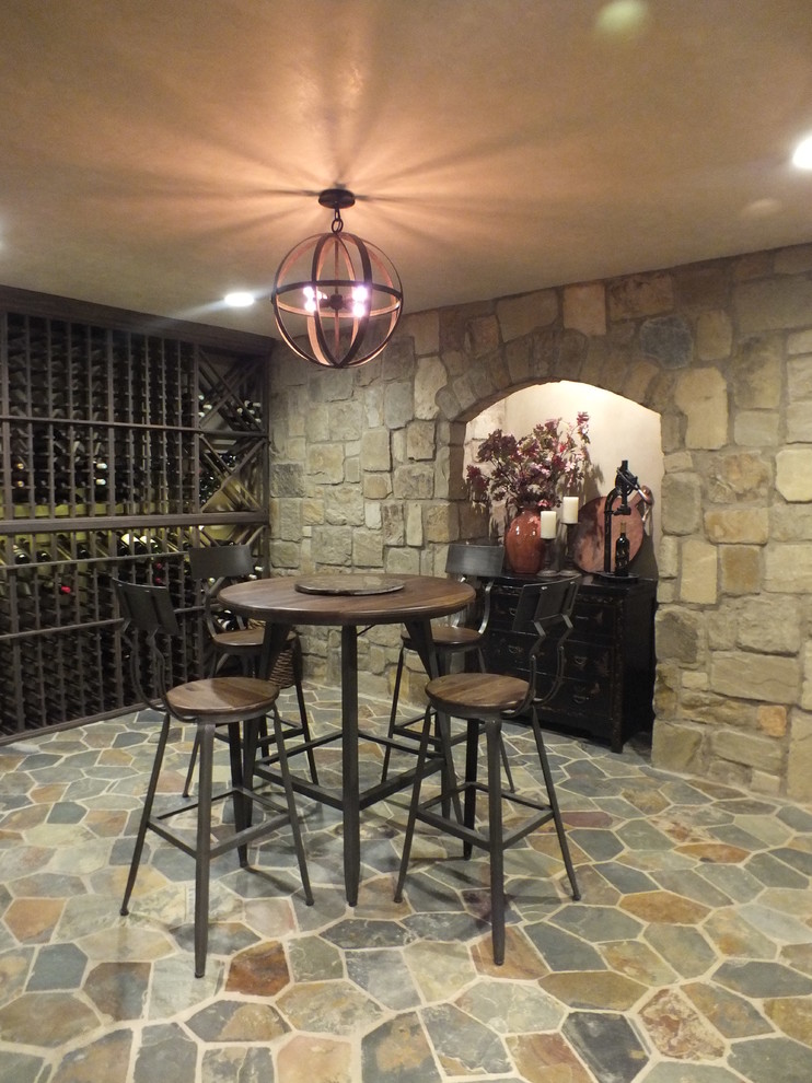 Country wine cellar in Los Angeles with slate floors and multi-coloured floor.