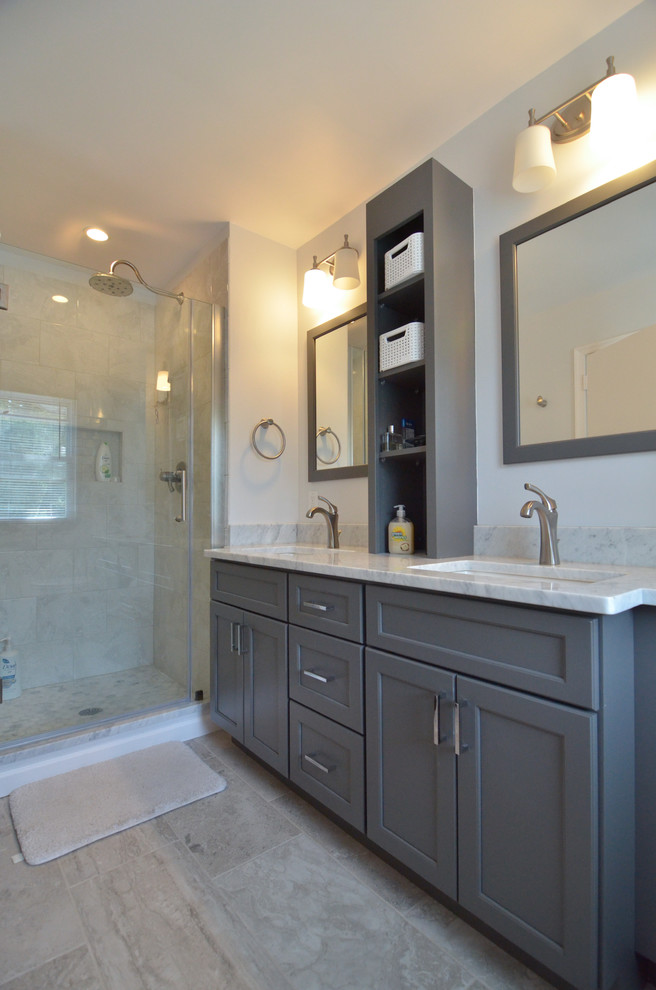Mid-sized transitional master bathroom in Philadelphia with an undermount sink, shaker cabinets, grey cabinets, marble benchtops, an alcove shower, a two-piece toilet, gray tile, ceramic tile, white walls and ceramic floors.