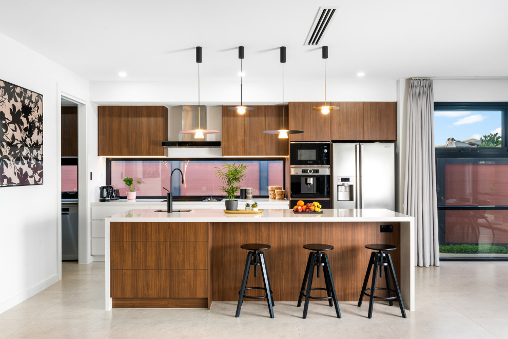 Design ideas for a contemporary kitchen in Adelaide with stainless steel appliances, with island, grey floor and white benchtop.