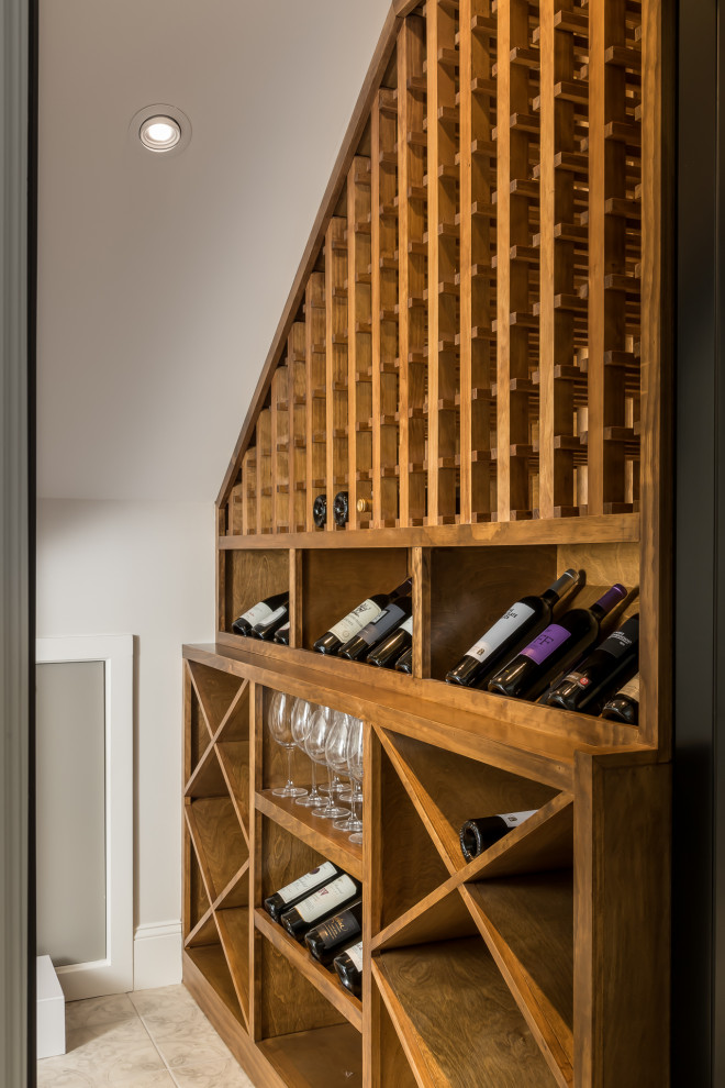 This is an example of a large beach style wine cellar in Atlanta with vinyl floors and beige floor.