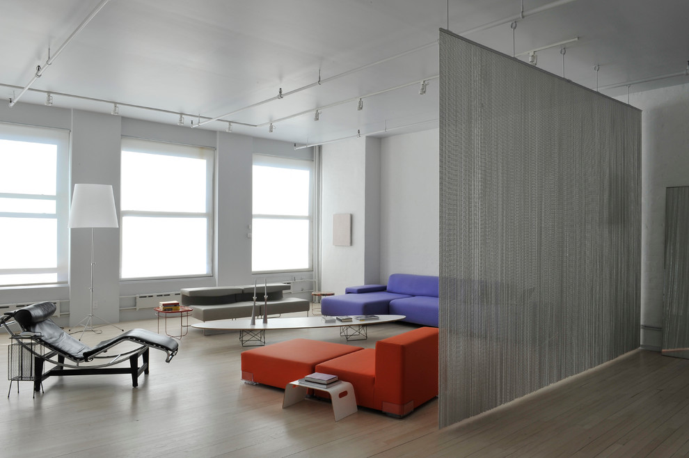 This is an example of a modern living room in New York with white walls.