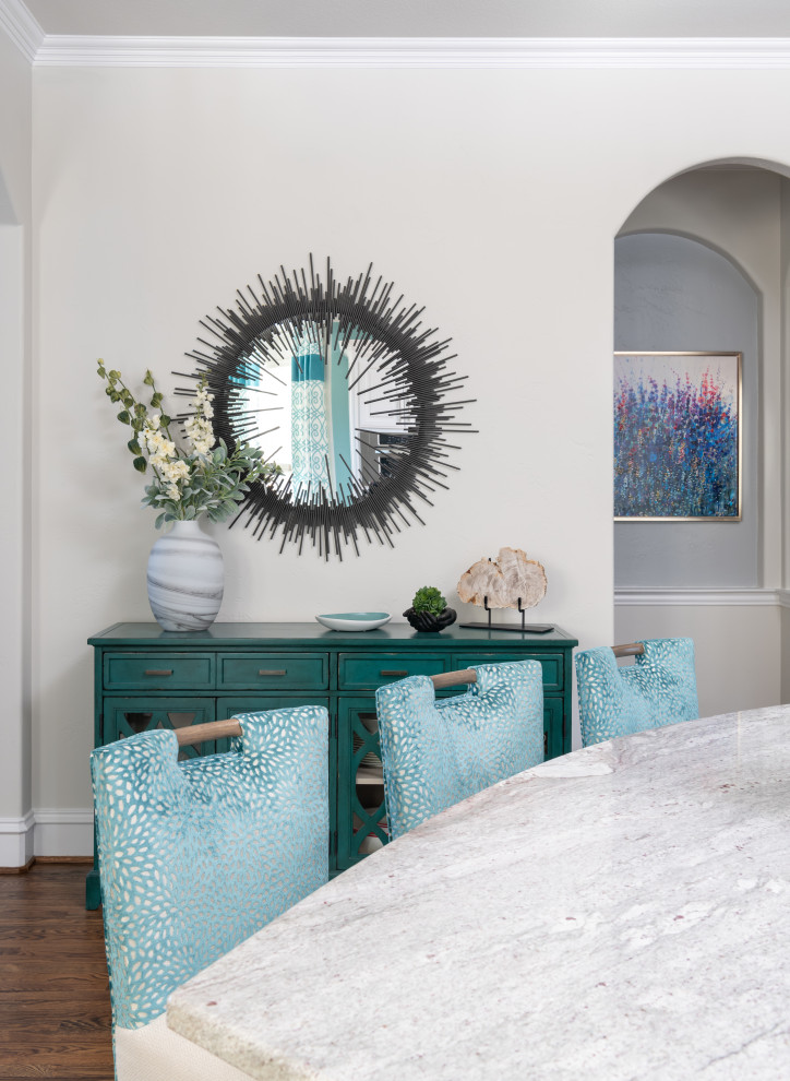 Inspiration for a large transitional u-shaped medium tone wood floor and brown floor kitchen remodel in Dallas with a farmhouse sink, white cabinets, granite countertops, white backsplash, stainless steel appliances, an island, gray countertops and raised-panel cabinets