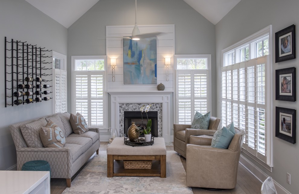 This is an example of a beach style open concept living room in Other.