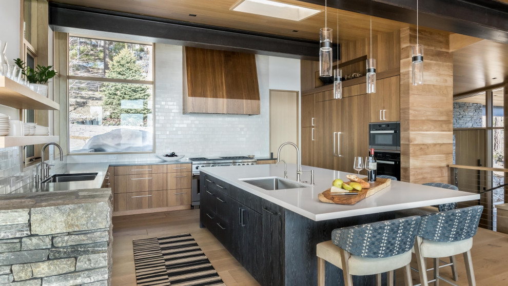 Large rustic u-shaped open plan kitchen in Other with flat-panel cabinets, engineered stone countertops, white splashback, ceramic splashback, integrated appliances, an island and a wood ceiling.