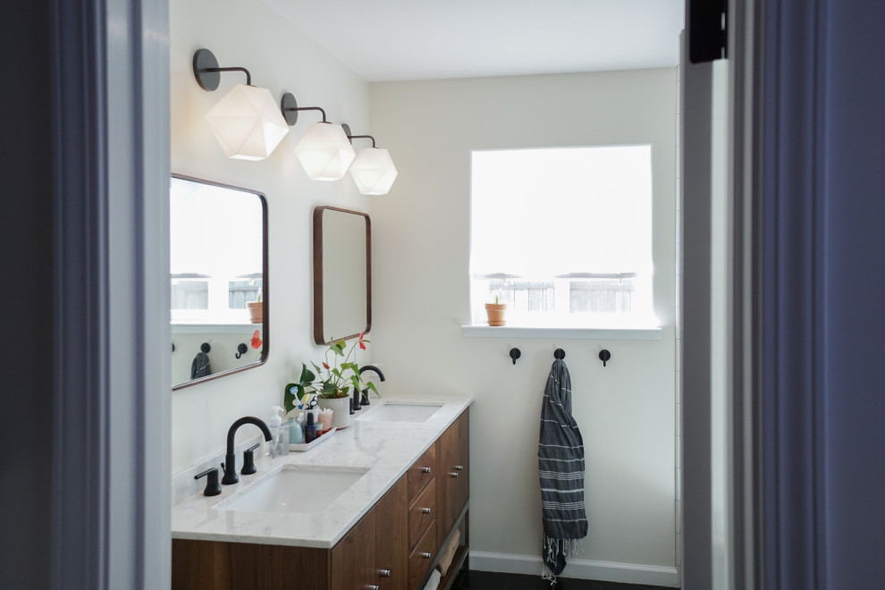 Design ideas for a mid-sized midcentury master bathroom in San Francisco with medium wood cabinets, a one-piece toilet, yellow tile, subway tile, white walls, ceramic floors, an undermount sink, marble benchtops, black floor, a hinged shower door and yellow benchtops.