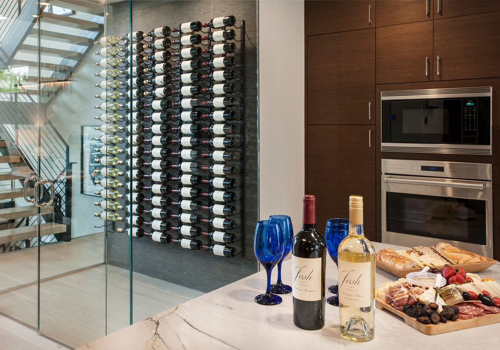 Inspiration for a mid-sized contemporary wine cellar in Philadelphia with light hardwood floors and display racks.