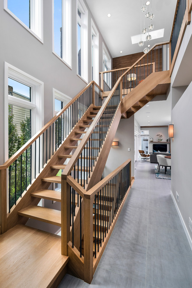 Mid-sized contemporary wood floating staircase in Chicago.