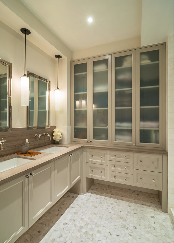 Example of a transitional brown tile mosaic tile floor bathroom design in New York with an undermount sink, recessed-panel cabinets, beige cabinets, beige walls and beige countertops