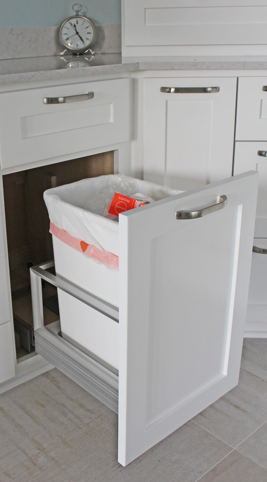 Drop-in bathtub - large transitional master beige tile and porcelain tile porcelain tile and beige floor drop-in bathtub idea in Austin with shaker cabinets, white cabinets, quartz countertops, an undermount sink, blue walls, a hinged shower door, beige countertops and a two-piece toilet