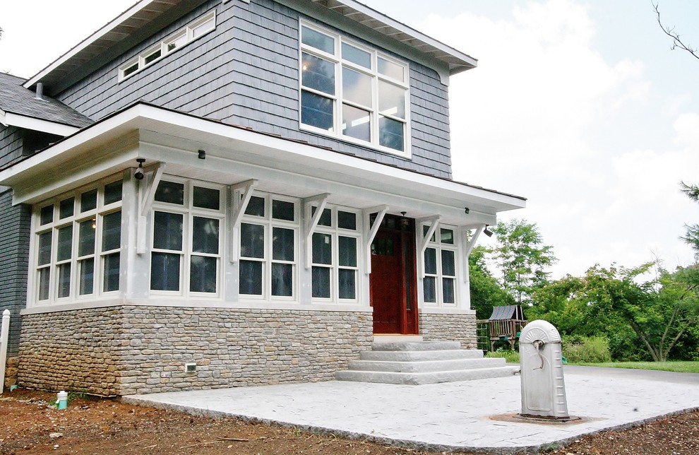 Example of a mid-sized arts and crafts blue two-story wood exterior home design