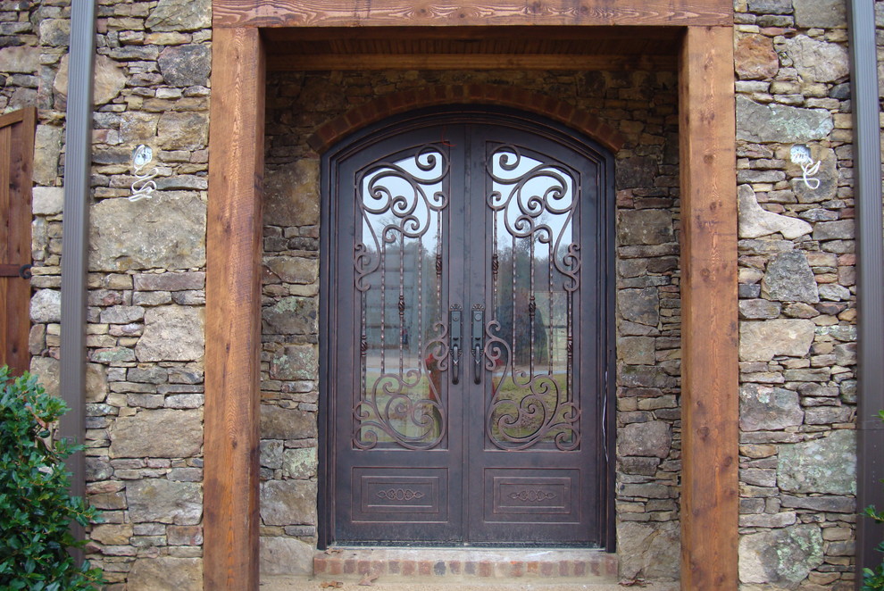 Photo of a large mediterranean front door in Other with a double front door.
