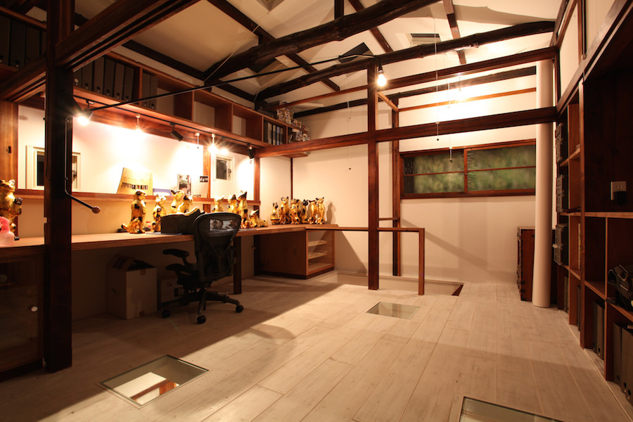 Photo of a mid-sized asian home studio in Tokyo with white walls, light hardwood floors, no fireplace and a built-in desk.