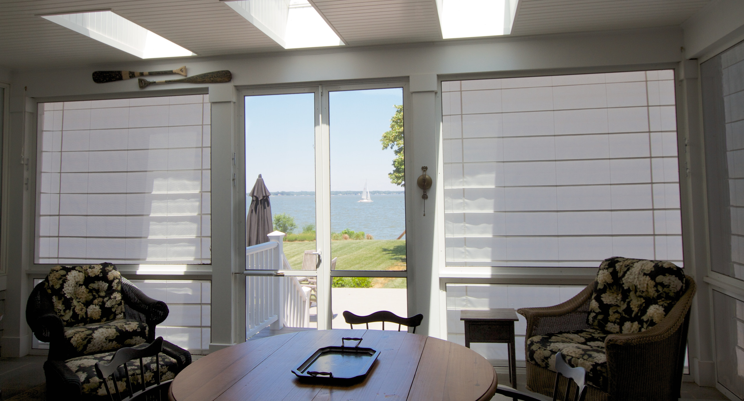 Outdoor shades protect your screen porch.