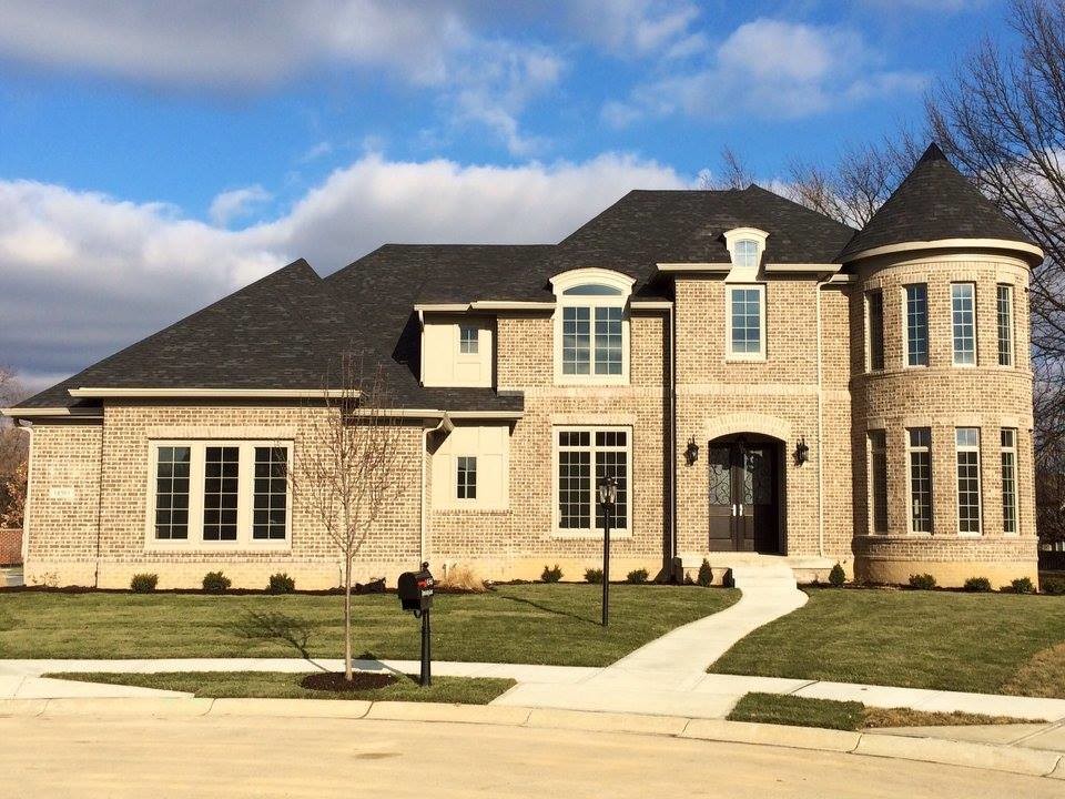 Traditional two-storey brick beige exterior in Indianapolis.