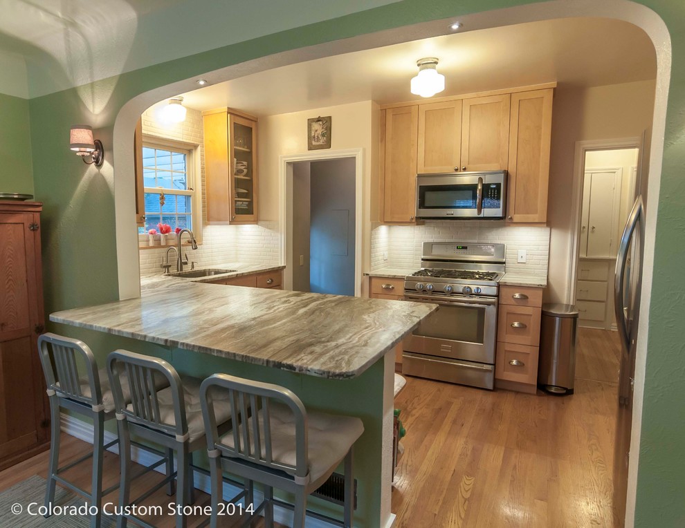 Example of a transitional kitchen design in Denver
