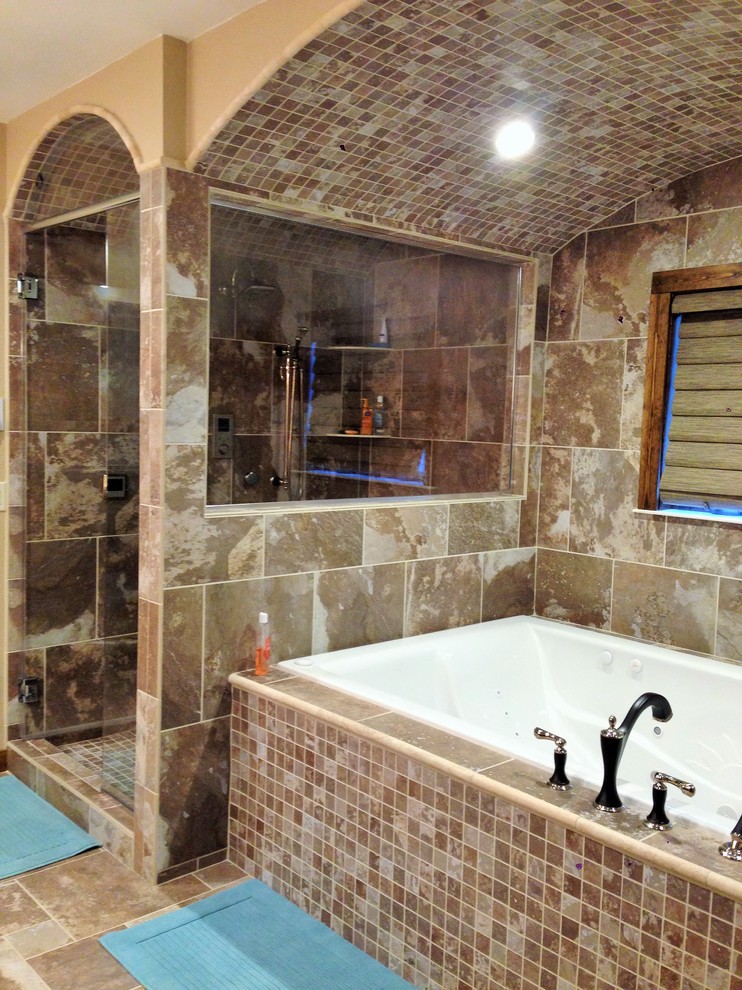 Drop-in bathtub - transitional master multicolored tile and porcelain tile porcelain tile drop-in bathtub idea with an integrated sink, recessed-panel cabinets, distressed cabinets, solid surface countertops and beige walls
