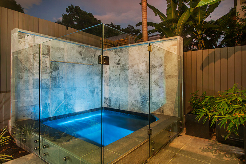 Photo of a small contemporary courtyard pool in Brisbane.