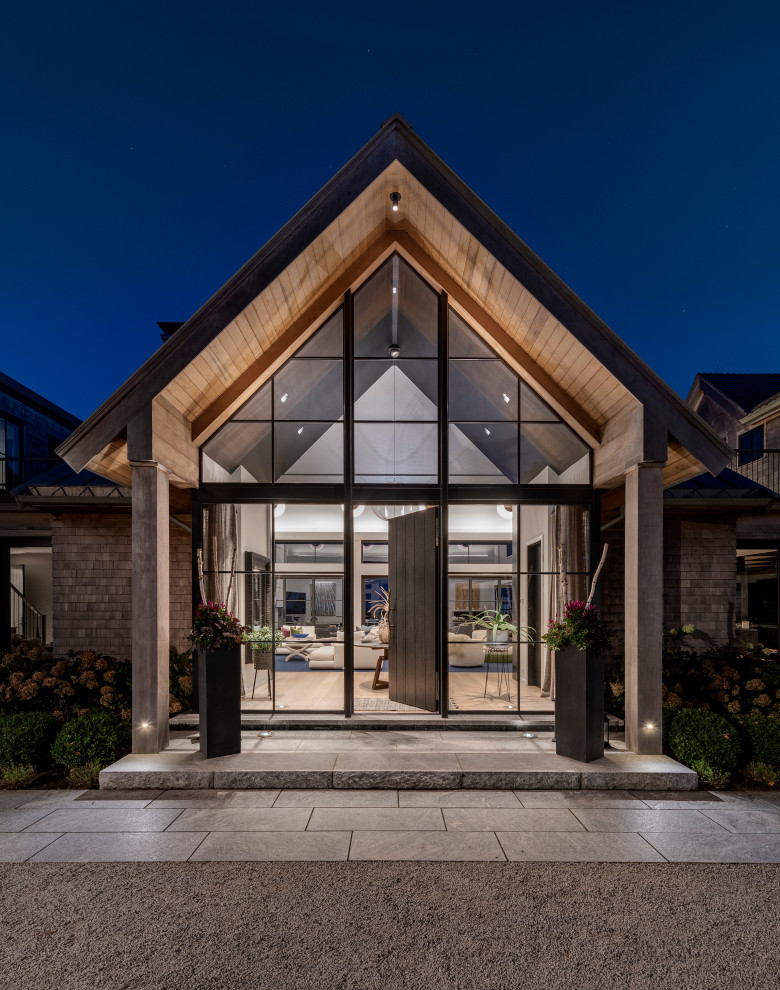 Example of a transitional home design design in Boston
