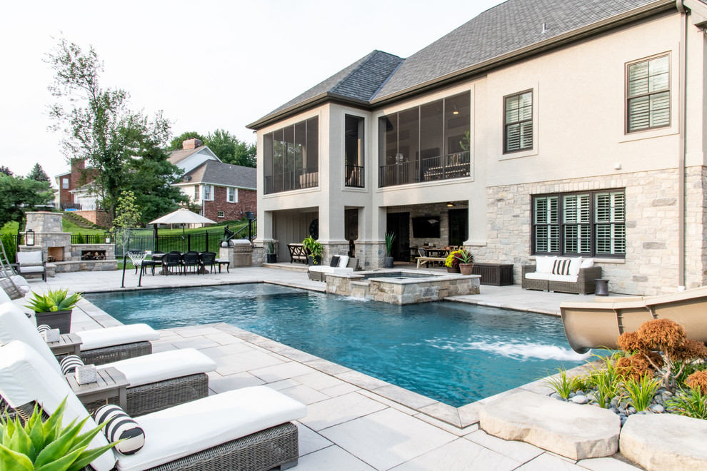 Design ideas for a large traditional backyard custom-shaped pool in St Louis.